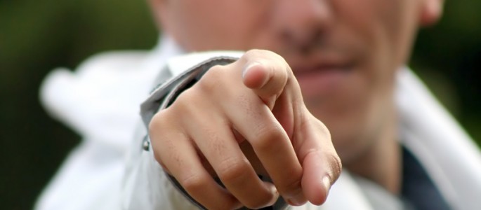 Angry man pointing aggressively